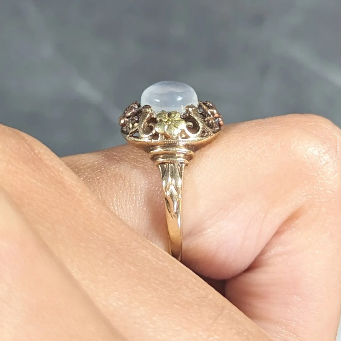 Arts & Crafts Moonstone Cabochon 14 Karat Tri-Colored Gold Floral Whiplash Antique Ring
