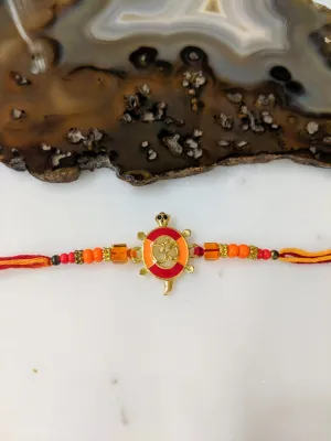 Gold Plated Rakhi With Tortoise OM Designer Multicolor Beads Thread Rakhi For Men