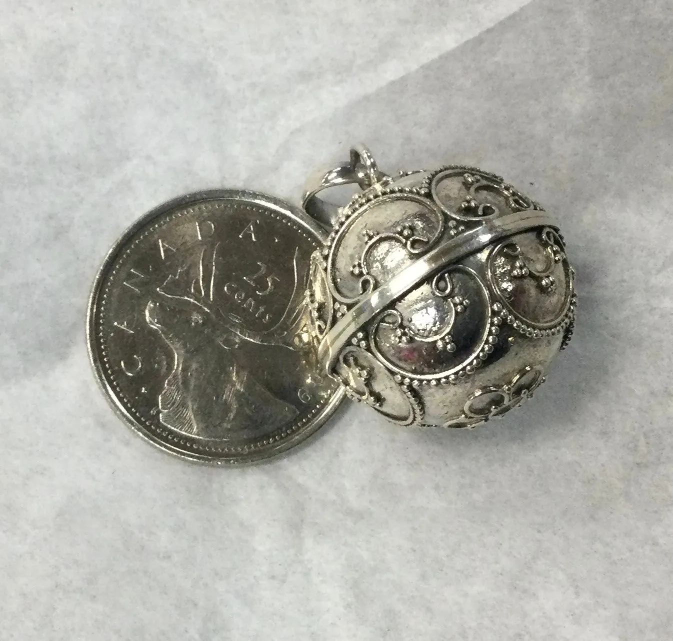 Ornate Silver Musical Ball Pendant